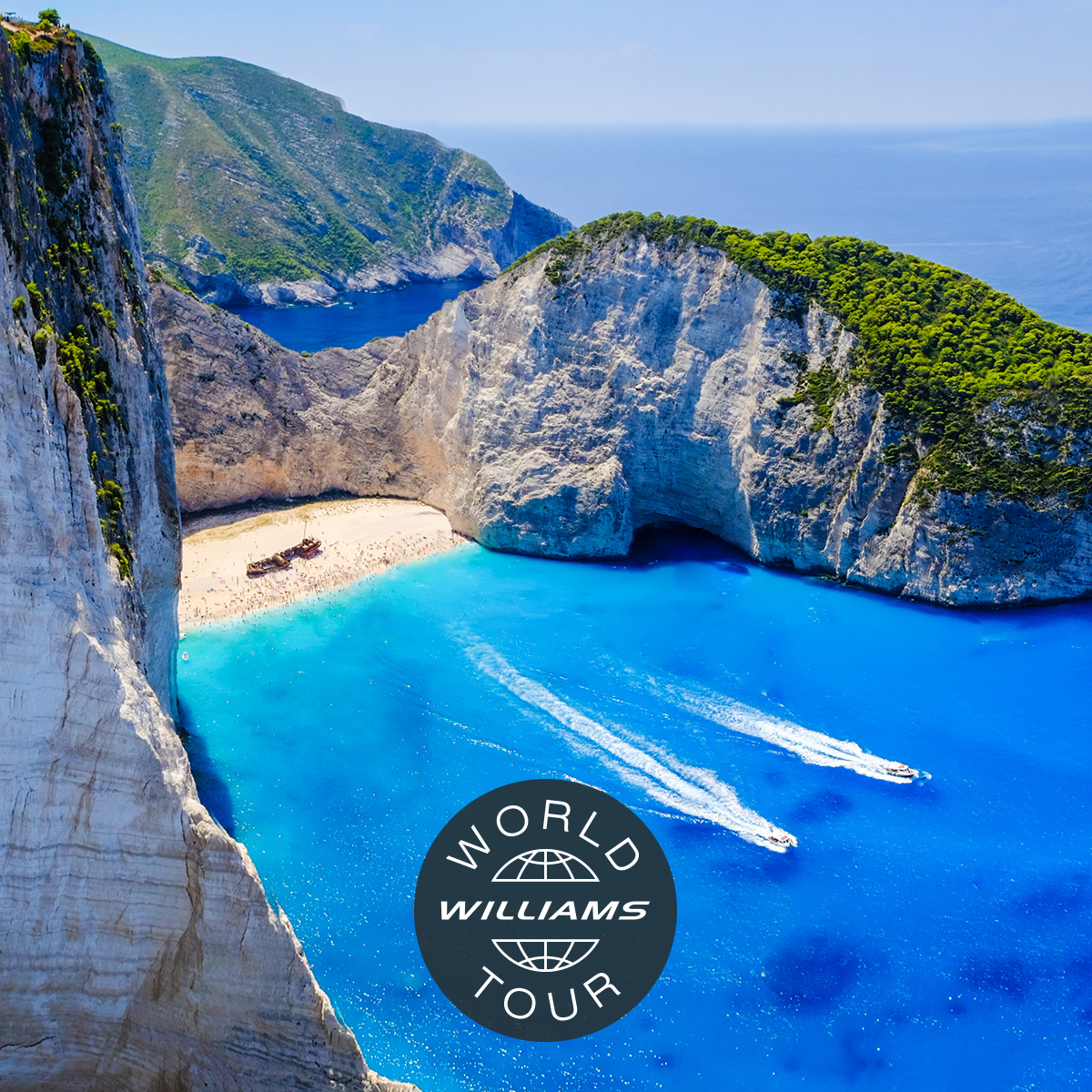Aerial view of a stunning beach with turquoise water, cliffs, and the Williams World Tour logo
